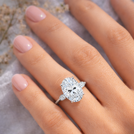 Elegant three stone Oval with Pear Accents